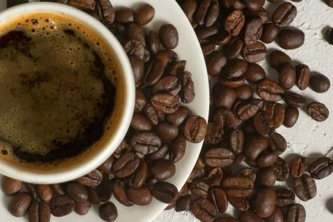 Coffee background, top view with copy space. White cup of coffee, ground coffee Stock Photos