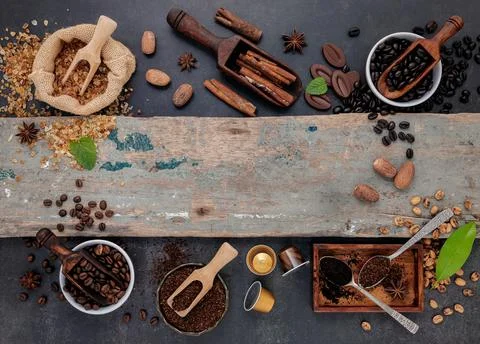 Coffee background with various of roasted coffee beans and flavourful ingredi Stock Photos