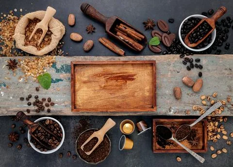 Coffee background with various of roasted coffee beans and flavourful ingredi Stock Photos