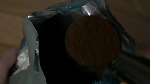 Coffee Bag opening and measuring grounds Stock Footage 146611073
