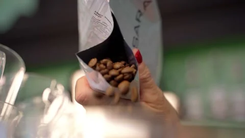Coffee bar with coffee beans and delicious breakfast in beautiful setting Stock Footage