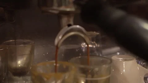 A coffee barista making a double shot of Espresso Stock Footage 246880191