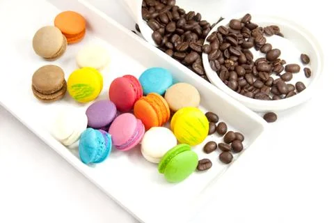 Coffee bean and mini macaroon colorful in white caramic plate Stock Photos