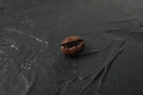 Coffee bean on black background, close up and space for text Stock Photos