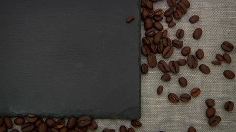 Coffee Bean On Black Stone Cutting Board Stock Footage 107542549