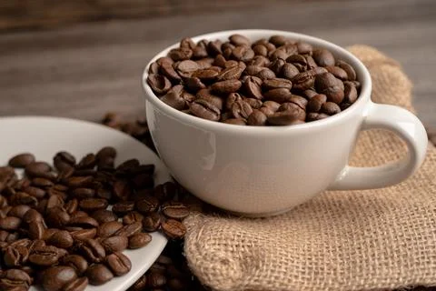 Coffee bean in cup with export text for import export trade commerce. Stock Photos