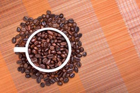 Coffee bean in cup Stock Photos