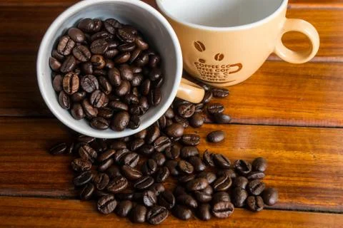 Coffee bean in a cup Stock Photos