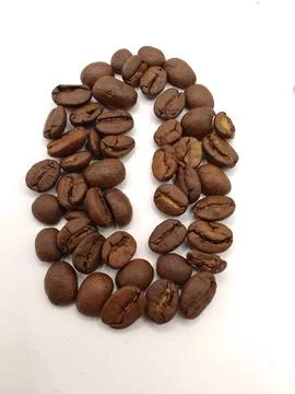 A coffee bean figure on a light background in the shape of a coffee Foto stock