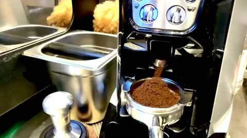 Coffee bean from glinder, coffee bean grounding Stock Footage 142321538