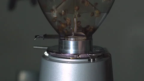 Coffee bean in grinder,Close-up roasted coffee beans in coffee machine Stock Footage 99113495