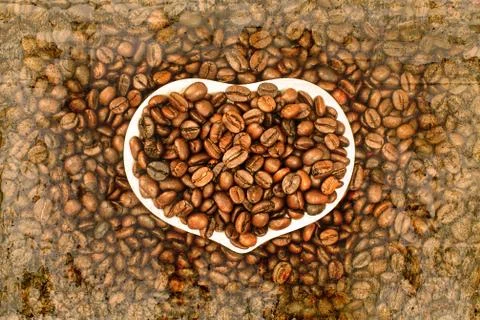 Coffee bean on old wall textured background. retro filter. Stock Photos