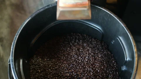 Coffee bean is roasting in roaster machine , Smoking from coffee . Stock Footage 137523681