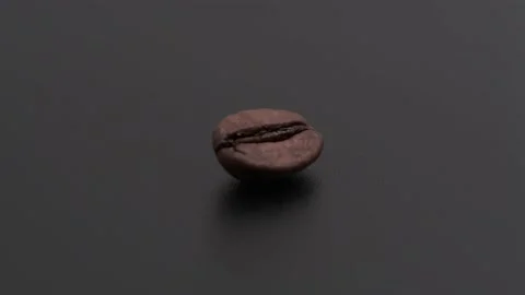 Coffee bean on a rotating black matte table 4k Stock Footage 151165035