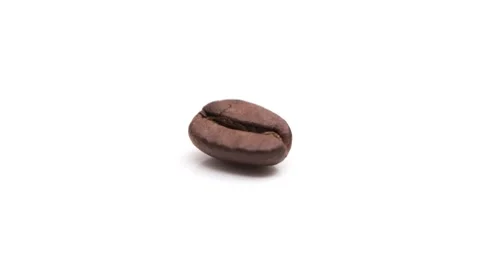 Coffee bean on a rotating white glossy table 4k Stock Footage 151165023