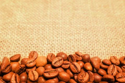 Coffee bean on sack background Stock Photos