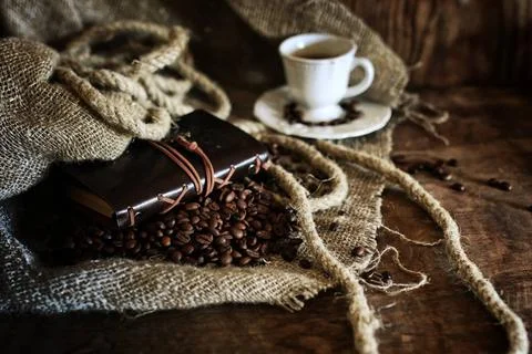 Coffee bean on textile background coffee bean and rope on the retro book ,... Stock-Fotos