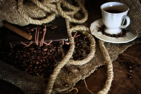Coffee bean on textile background various vintage elements on old worn bac... Stock-Fotos