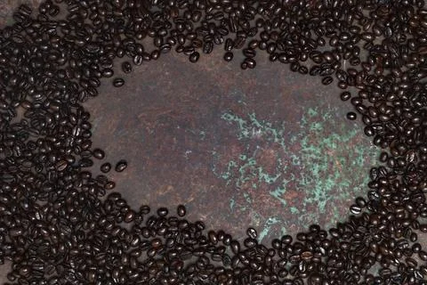 Coffee bean texture on metal background copy space. Stock Photos