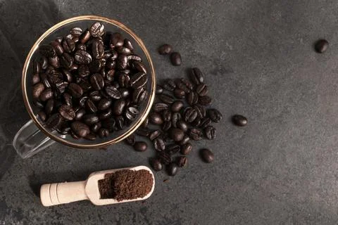 Coffee bean texture on stone background copy space. Stock Photos