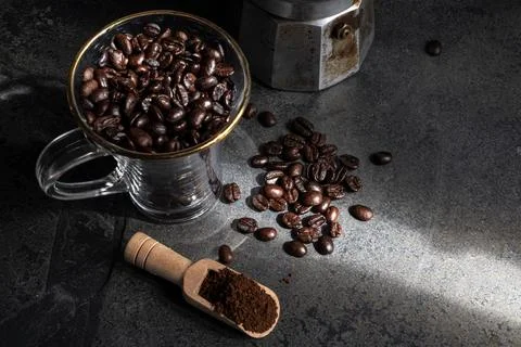 Coffee bean texture on stone background copy space. Stock Photos