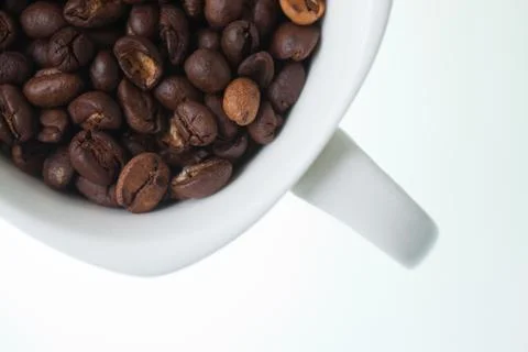 Coffee bean in white cup Stock Photos