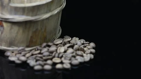 Coffee beans and coffee basket on black mirror Stock Footage 149374336