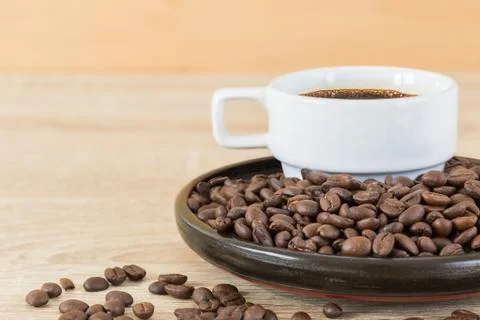 Coffee beans and coffee cup Stock Photos