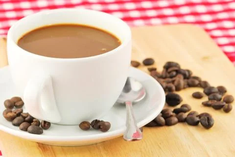Coffee beans and coffee mug Stock Photos