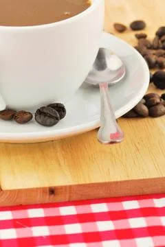 Coffee beans and coffee mug Stock Photos