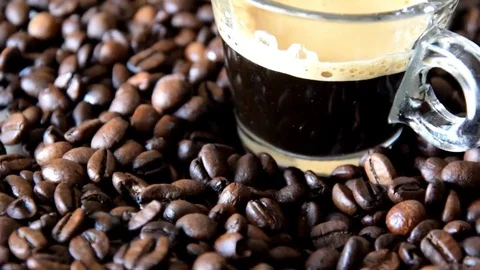 Coffee beans and cup Видео 73961587