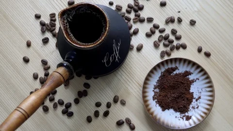 Coffee beans and cup Stock Footage 128948995
