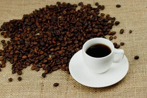 Coffee beans and cup Stock Photos