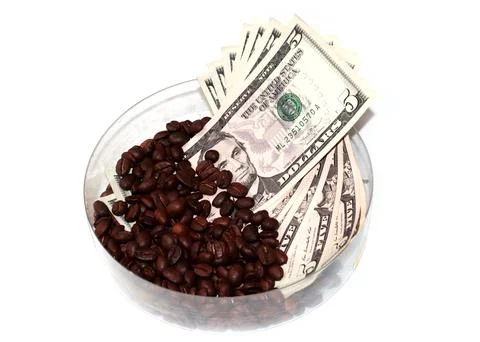 Coffee beans and dollars Stock Photos