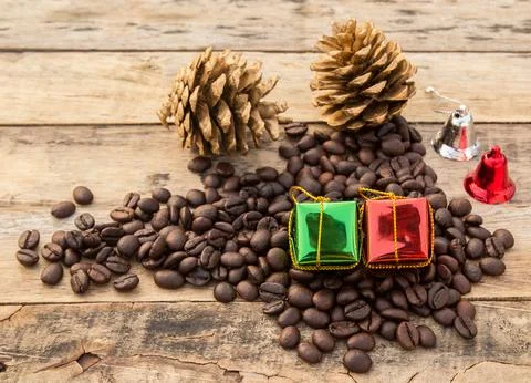 Coffee beans and gift box on wooden background Stock Photos