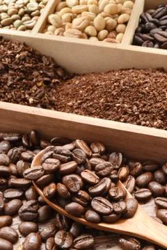 Coffee beans and ground with spoon Stock Photos