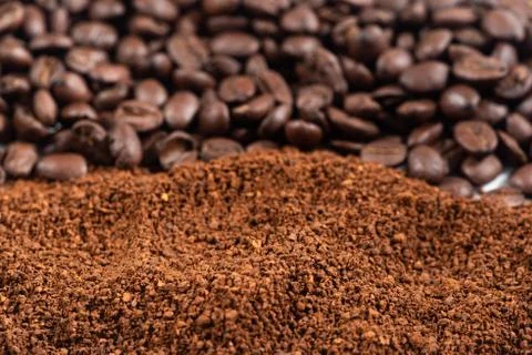 Coffee Beans and Grounds background.Roasted coffee beans and grounds. Stock Photos