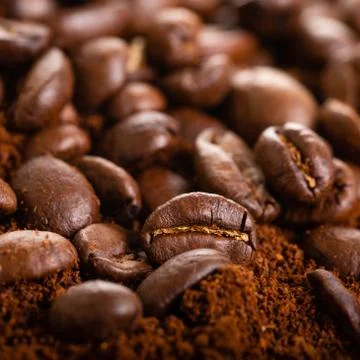 Coffee Beans and Grounds Close up. Background. Stock Photos