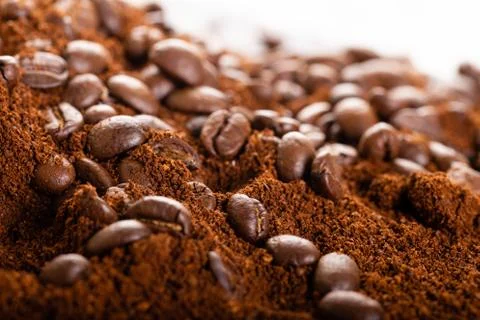 Coffee Beans and Grounds Close up. Background. Stock Photos