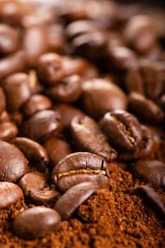 Coffee Beans and Grounds Close up. Background. Stock Photos