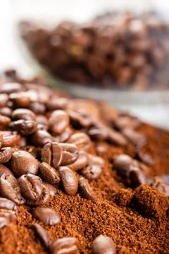 Coffee Beans and Grounds Close up. Background. Stock Photos