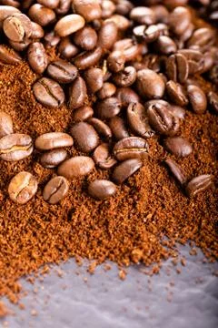 Coffee Beans and Grounds Close up. Background. Stock Photos