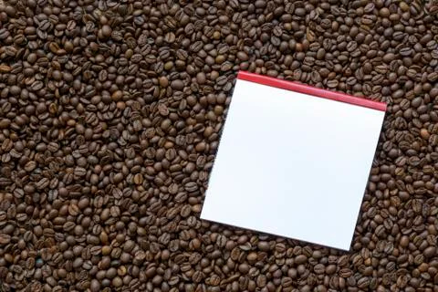 Coffee beans and a note Stock Photos