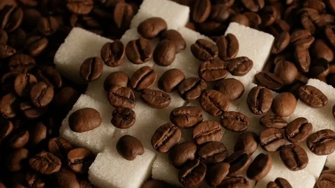 Coffee beans and sugar cubes close-up rotate Stock Footage 74774076