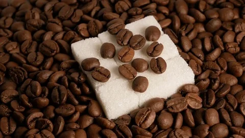 Coffee beans and sugar cubes close-up rotate Stock Footage 74774222