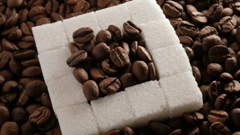 Coffee beans and sugar cubes close-up rotate Stock Footage 74774374