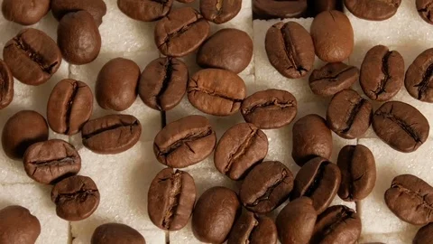 Coffee beans and sugar cubes close-up rotate Stock Footage 74775225