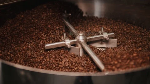 Coffee beans are being mixed in a steel bowl. Stock Footage 111065034