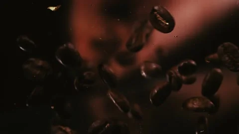 Coffee Beans are Dropped From Above by a Hand Stock Footage 300892553