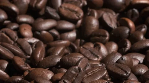 Coffee beans are falling, slow motion. Coffee beans roasted close-up.Vietnamese  Video stock 155119419